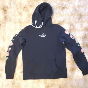 Hollister Junior's Black Hoodie with Pink Floral Sleeves, Size S